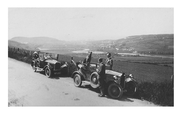 Pritchards and their dog out for a spin in their motors c1925