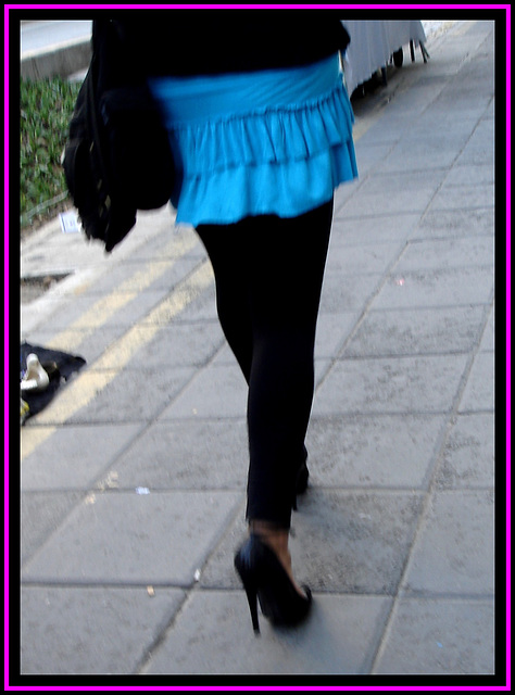 Black pumps and tights with short skirt