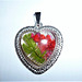 Heart-shaped pendant with red flowers.
