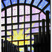 Stained glass window behind the pipe organ