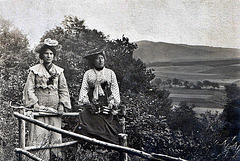 two Ladies & a fence from the past (about 1905)