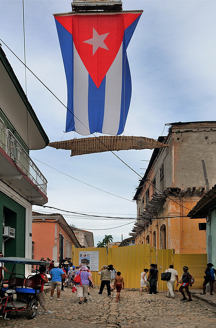 Cuba national flag over an alley in Trinidad