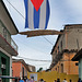Cuba national flag over an alley in Trinidad