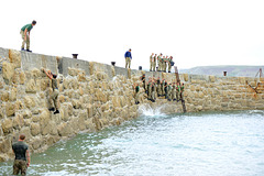 The Challenge is traverse Sennen Cove Sea Wall without falling in