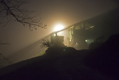 Turns on a light in the night and in the fog appears a farm