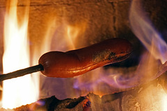 Hot Dogs Roasting On An Open Fire