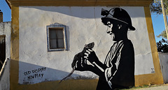 Mural of the miner and the rat.