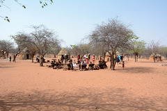 Namibia, Tourists in the Traditional Himba Village of Onjowewe