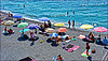 Spiaggia libera a Quinto : ombrelloni personali di tanti colori