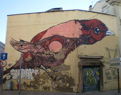 Huge bird on wall.