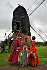 Medieval family discussing the windmill