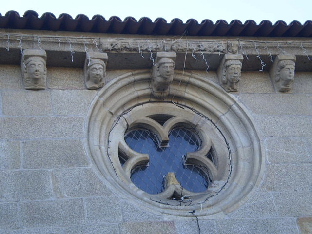 Rose window and corbelling.
