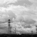 Power towers under rain clouds