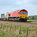 DB Cargo UK class 66 66137 with 3Z12 09.25 Knottingley T.M.D. - Knottingley T.M.D. via Scarborough,Bridlington, Hull Scarborough ,York Weedkiller train at Willerby Carr Crossing 3rd May 2020.