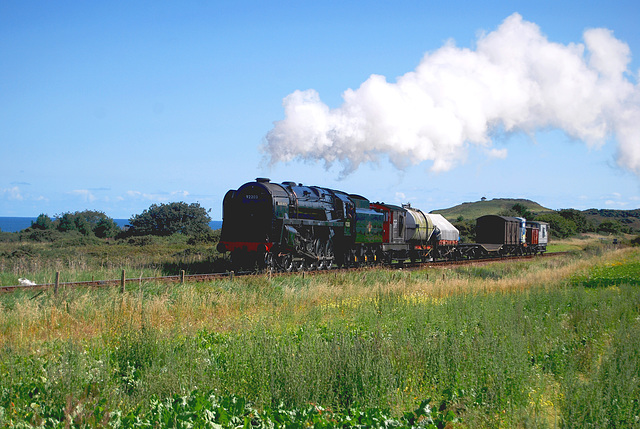 BR 9F 2-10-0 - 92203 "Black Prince" hauls a Freight train along the coast to Weybourne