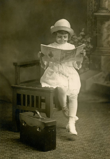 Girl Reading the North American Newspaper