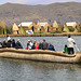 Bringing tourists in a reed boat to the Uros floating islands