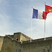 The Castle Walls at Caen - with flags of France and Normandy