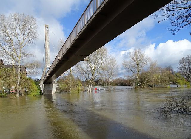Footbridge to flooded car park