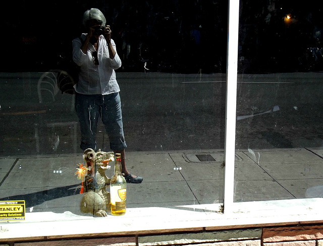 Self-portrait with rat and bottle