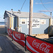 Triple Coca-cola fence by the beach