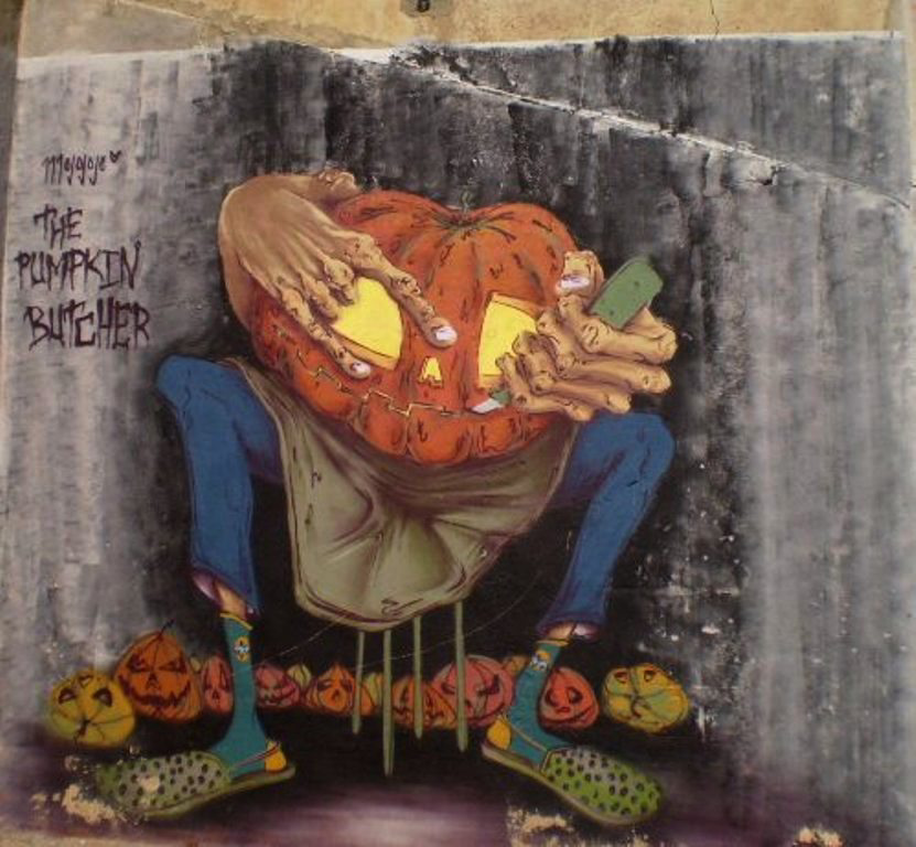 Halloween street art - the pumpkin butcher.