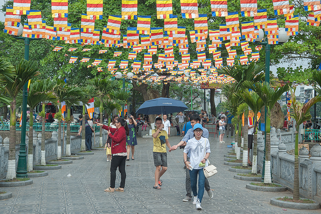 Local visitors walk to Tran Quoc Pagoda