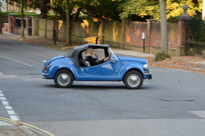 Blonde in a blue car