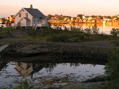 Golden hour in Reinevågen bay, village Reine in the background