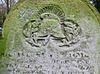 abney park cemetery, london,fireman's helmet on gravestone of william henry maidman 1873, paid for my his comrades after 40 years of service