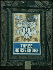 Three Horseshoes pub sign
