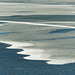 Distant ice patterns on the reservoir
