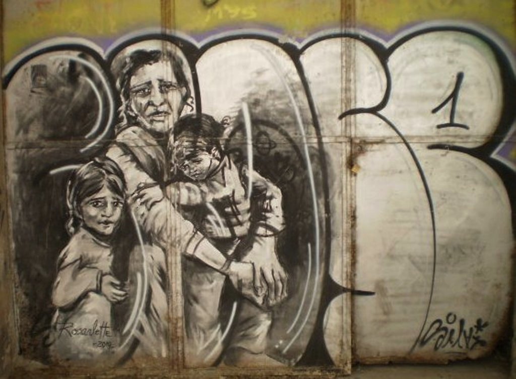Mother and children at the door of abandoned building, by Rosarlette.