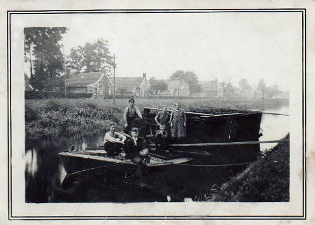 Grandparents transporting peat
