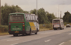 Badgerline 2206 (CSV 231,A206 SAE) and Premier Travel 330 (C330 PEW) passing through Red Lodge – 20 Aug 1988 (71-20)