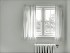 White room with curtains.