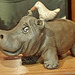 Hippo, with white bird holding the rind clean, handmade from cla