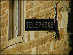old telephone sign