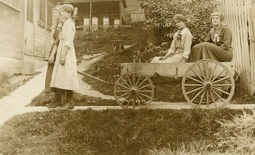 Girls Pulling Themselves on a Wagon