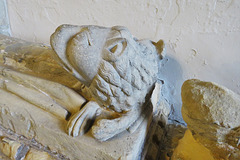 west tanfield church, yorkshire,battered late c14 lady with big lion on chest tomb with heraldry
