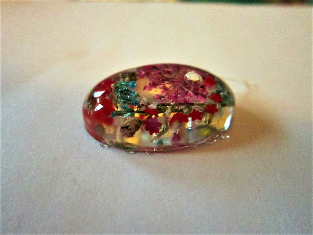 Small oval with red flowers and greenery