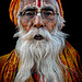 old sadhu with black lips