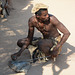 Namibia, An Ancient Blacksmith in the Damara Living Museum Works with a Modern Iron Rebar