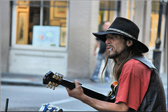 A hat, a cigarette and a guitar
