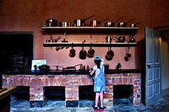 A wall full of pots and pans in Buckland Abbey kitchen.