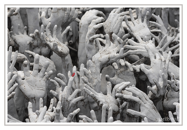 Hands in Wat Rong Khun White Temple / Thailand