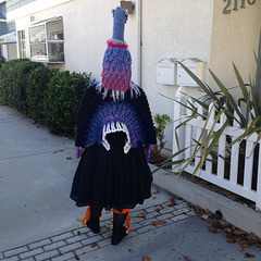 Giant crocheted bird costume
