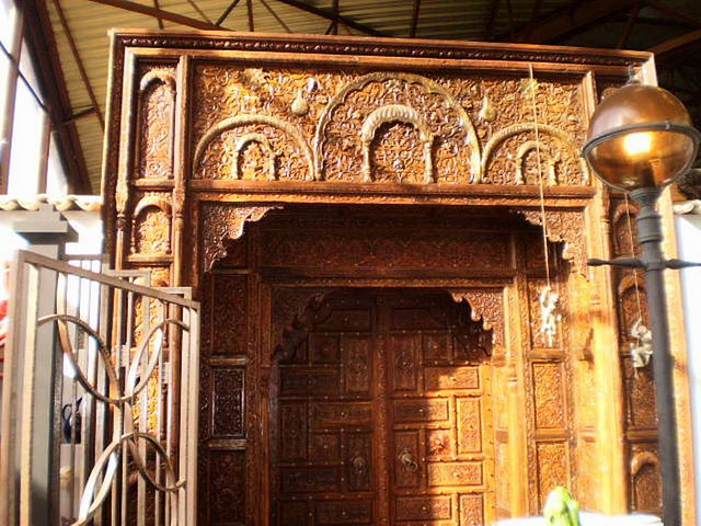 Door carved in teak wood.