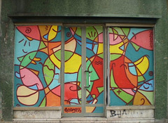 Painting on door and windows of abandoned shop.
