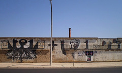 Intervention on wall of former canned fish factory.